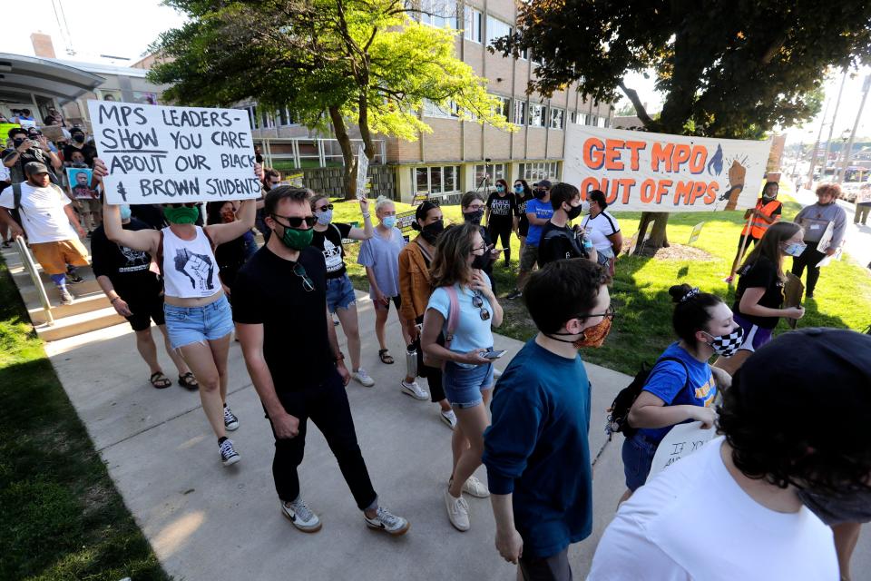 Black Lives Matter and other protest groups joined for a rally at Milwaukee Public Schools Central Office, calling for defunding of police and removing officers from MPS schools and replacing them with social workers, and counselors, Wednesday, June 17, 2020 in Milwaukee, WI.