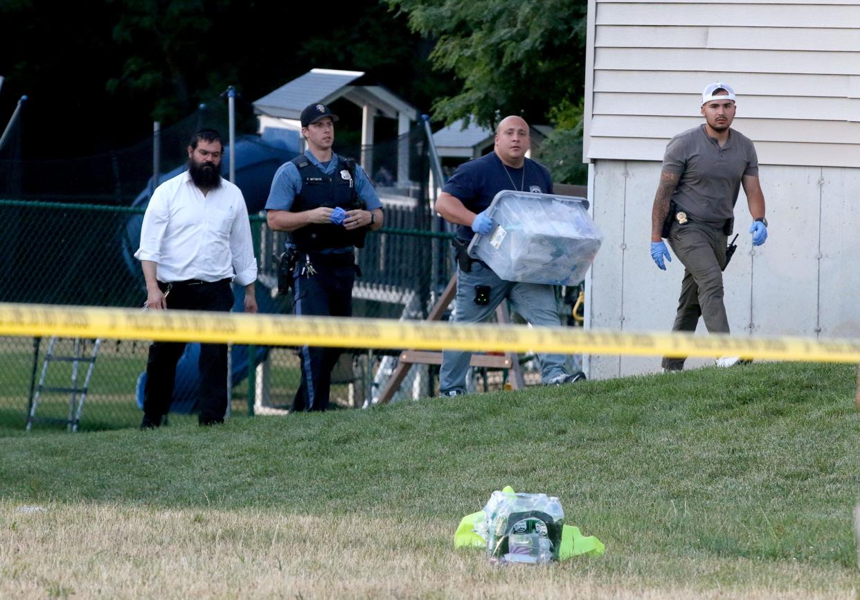 Police collect evidence at the scene of a home on Shenandoah Drive at Rockbridge Road in Lakewood Tuesday evening, June 25, 2024.