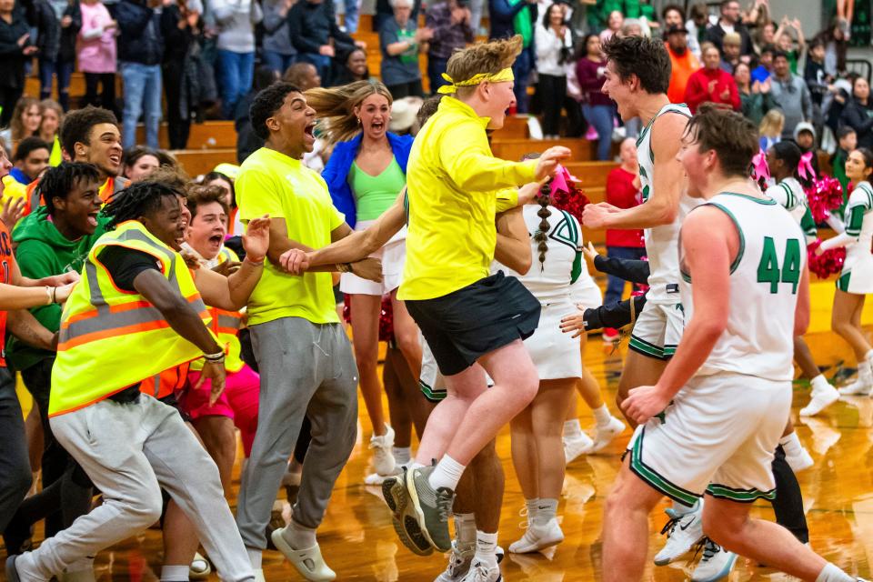 Concord students celebrate with the team after they won the Concord vs. NorthWood boys basketball game Thursday, Feb. 1, 2024 at Concord High School.