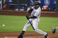 Colorado Rockies' Charlie Blackmon doubles against the Seattle Mariners in the first inning of a baseball game Sunday, Aug. 9, 2020, in Seattle. (AP Photo/Elaine Thompson)