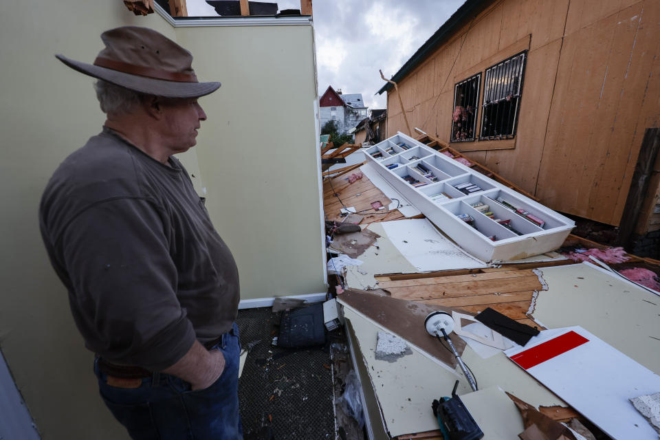 Mel Gilmer surveys the damage to his business after a tornado passed through downtown Selma, Ala., Thursday, Jan. 12, 2023. Gilmer took shelter in the bathroom as the tornado hit. (AP Photo/Butch Dill)