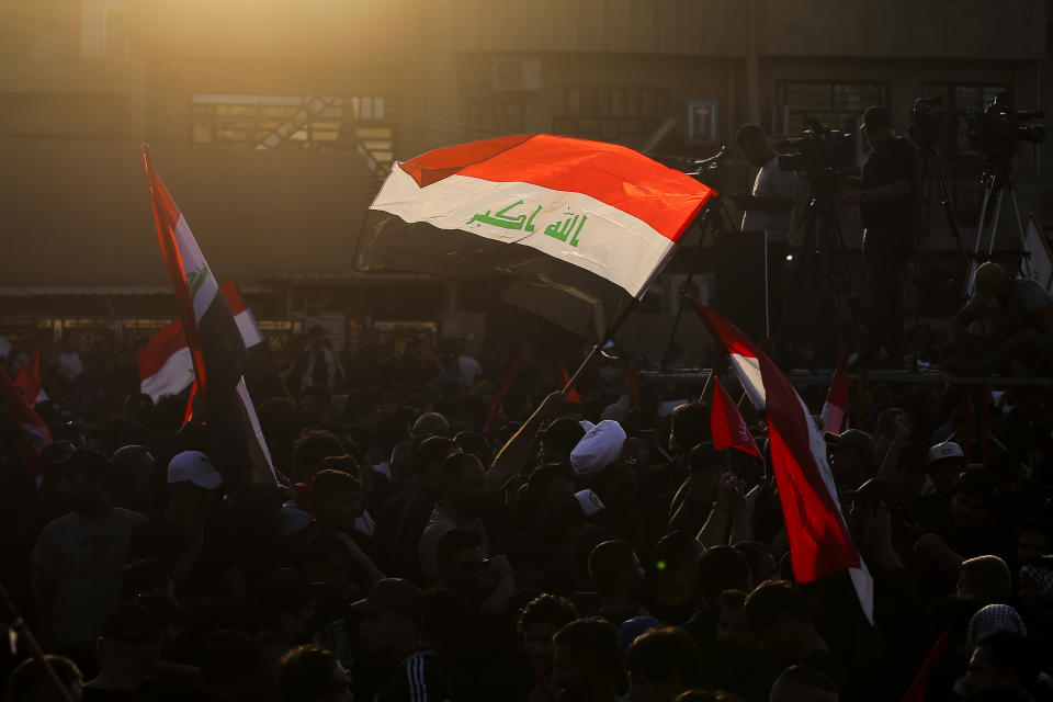 FILE - Supporters of Iran-backed Shiite Coordination Framework attend a rally to denounce their rivals, followers of an influential Shiite cleric Muqtada al-Sadr who stormed the parliament last month and have since been holding a sit-in outside the assembly building in Baghdad, Iraq, Friday, Aug. 12, 2022. Al-Sadr is a populist cleric, who emerged as a symbol of resistance against the U.S. occupation of Iraq after the 2003 invasion. (AP Photo/Anmar Khalil, File)