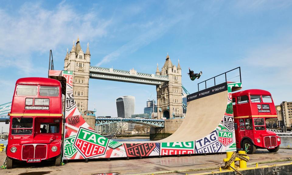 <span>Sky Brown displays her dazzling repertoire of tricks on a half-pipe between two London buses.</span><span>Photograph: PR handout</span>