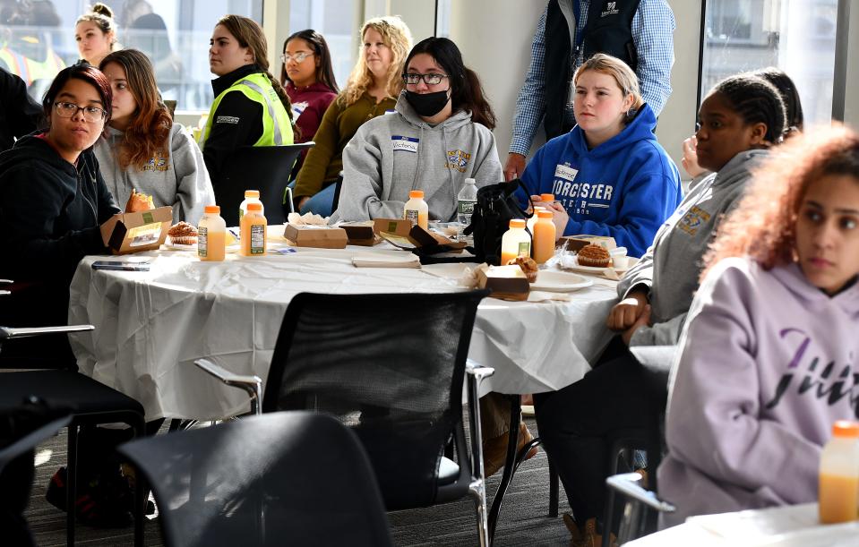 Students from Worcester Technical High School listen during a Women in Construction conference Friday at UMass Chan Medical School.