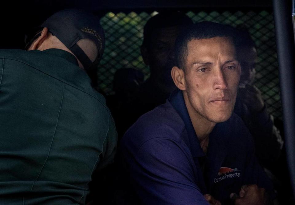 Key Largo, FL- January 8, 2023 - Cuban migrant inside a Customs and Border protection vehicle as he waits to be taken for processing with the rest of the group. A group of Cuban migrants landed in Key Largo early Sunday morning they were quickly taken for processing.