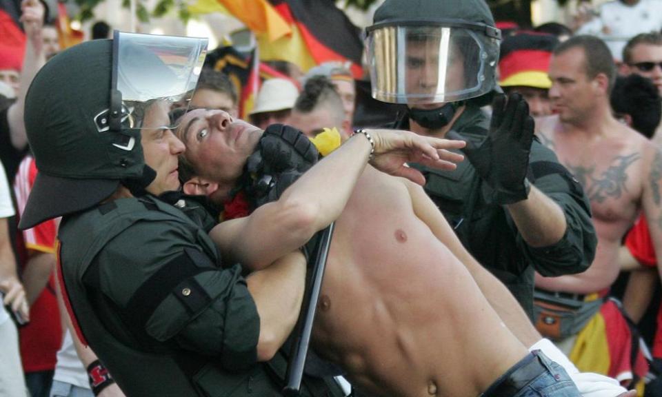 England and Germany football fans clash with German riot police in Stuttgart during the World Cup tournament 24 June 2006.