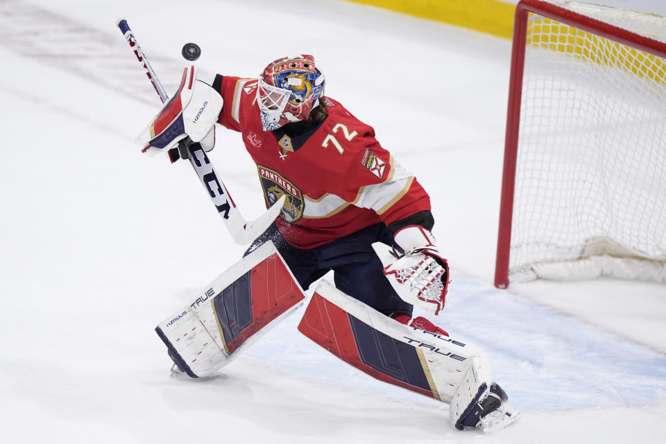 Florida Panthers goaltender Sergei Bobrovsky deflects a shot during the first period of Game 5 of the first-round of an NHL Stanley Cup Playoff series against the Tampa Bay Lightning, Monday, April 29, 2024, in Sunrise, Fla. (AP Photo/Wilfredo Lee)