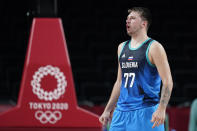 Slovenia's Luka Doncic celebrates at the end of a men's basketball preliminary round game against Spain at the 2020 Summer Olympics, Sunday, Aug. 1, 2021, in Saitama, Japan. (AP Photo/Charlie Neibergall)