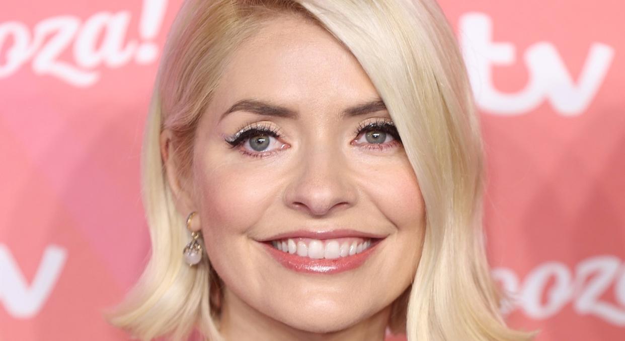 Shop Holly Willoughy’s Christmas outfits. (Getty Images) 