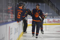 Edmonton Oilers' Darnell Nurse (25) celebrates a goal against the Vancouver Canucks with teammates during the third period of an NHL hockey game Wednesday, Jan. 13, 2021, in Edmonton, Alberta. (Dale MacMillan/The Canadian Press via AP)