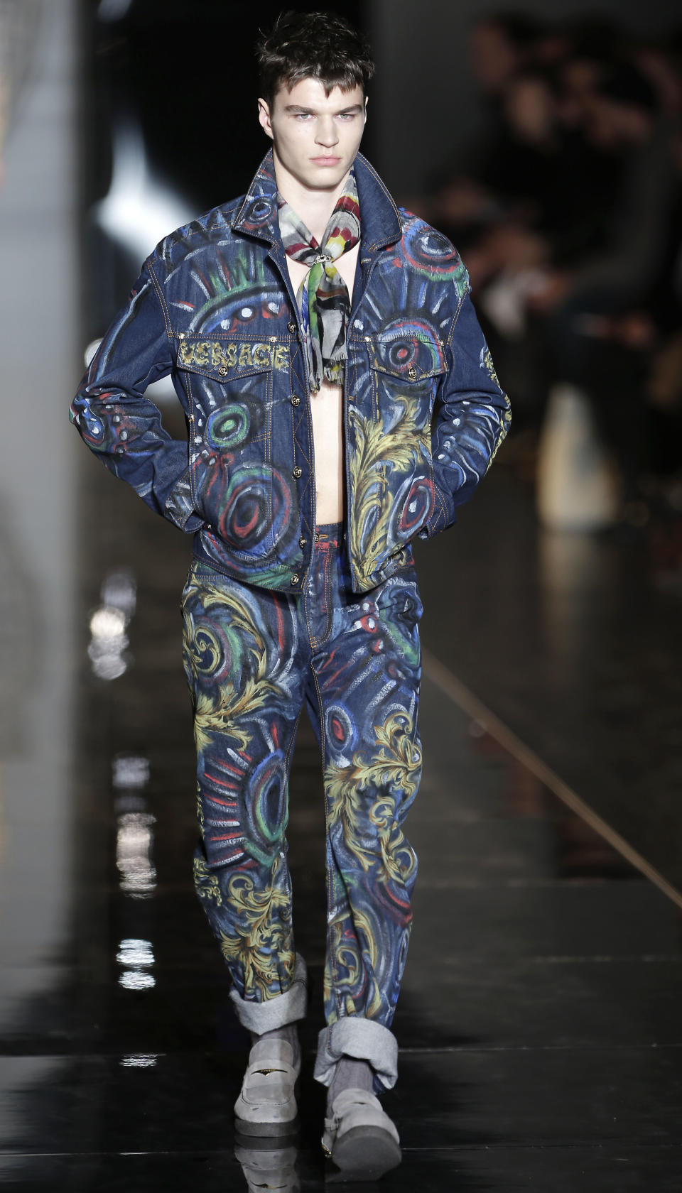 A model wears a creation of Versace men's Fall-Winter 2013-14 collection, part of the Milan Fashion Week, unveiled in Milan, Italy, Saturday, Jan. 12, 2013. (AP Photo/Antonio Calanni)