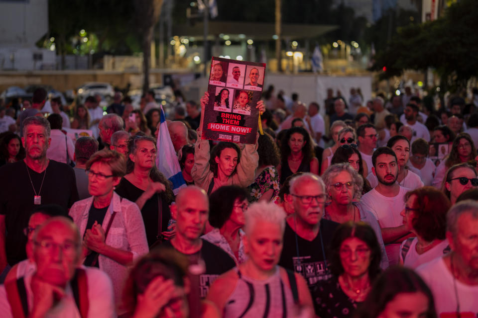 People gather during a demonstration in solidarity with friends and relatives held hostage in the Gaza Strip, in Tel Aviv, Israel, Friday, Nov. 3, 2023. (AP Photo/Bernat Armangue)