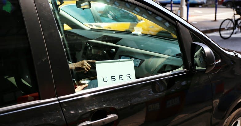 uber sign on car window