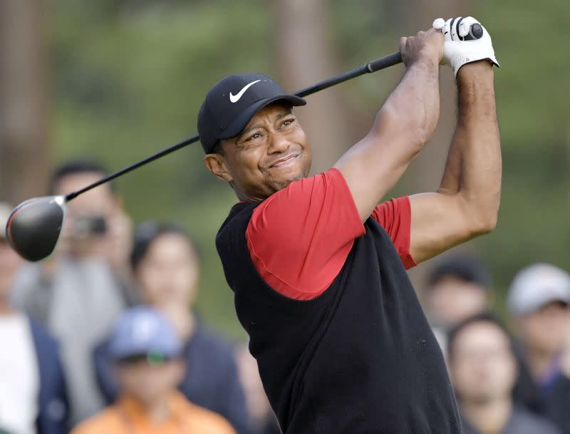 FILE PHOTO: Tiger Woods tees off the 9th hole during the final round of the Zozo Championship, a PGA Tour event, at Narashino Country Club in Inzai, Chiba Prefecture, Japan