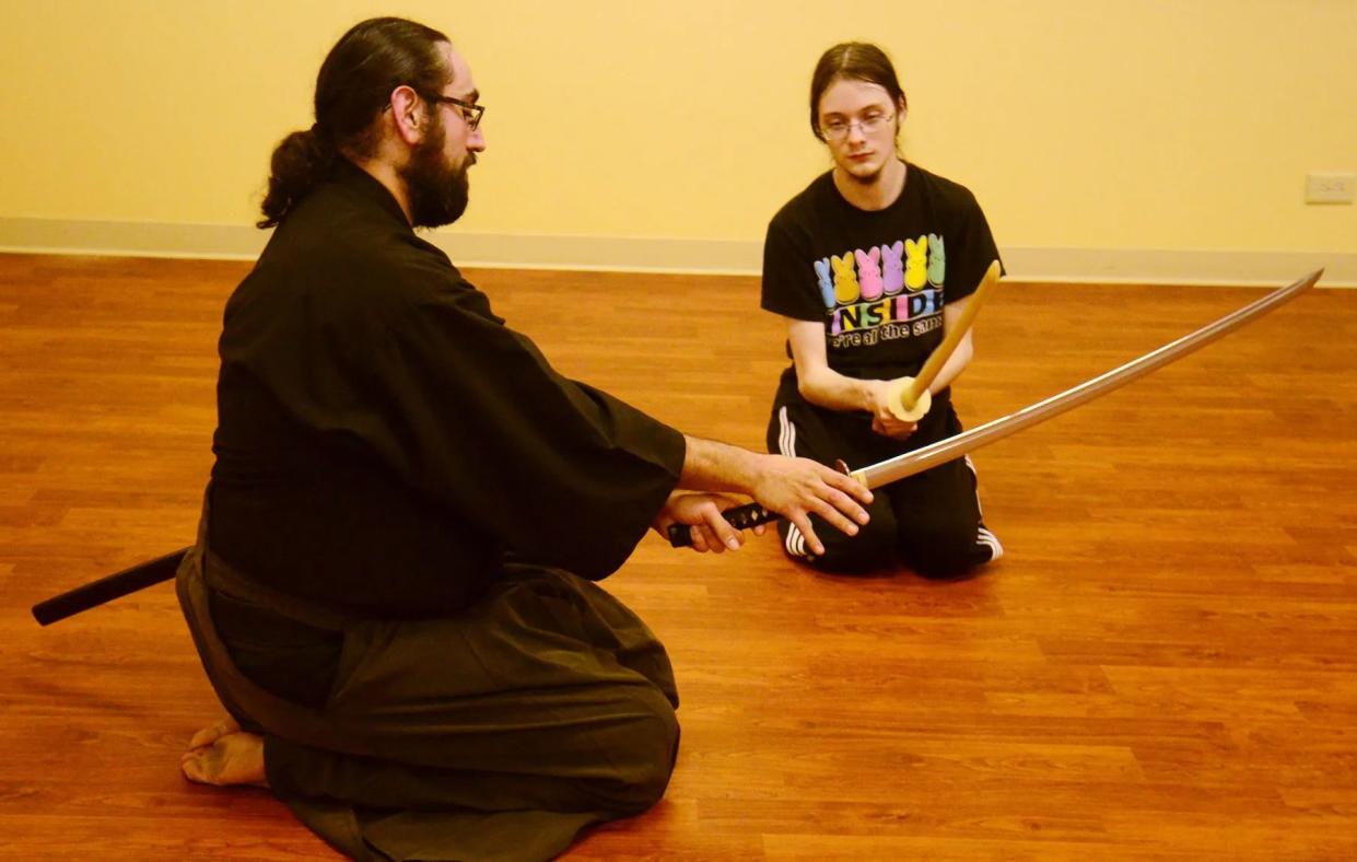 Abel Erives shows a student a Iaido martial arts technique in 2016 in Salina. Erives was arrested in connection to an aggravated battery in Vero Beach, Florida in July in which a man was stabbed multiple times.