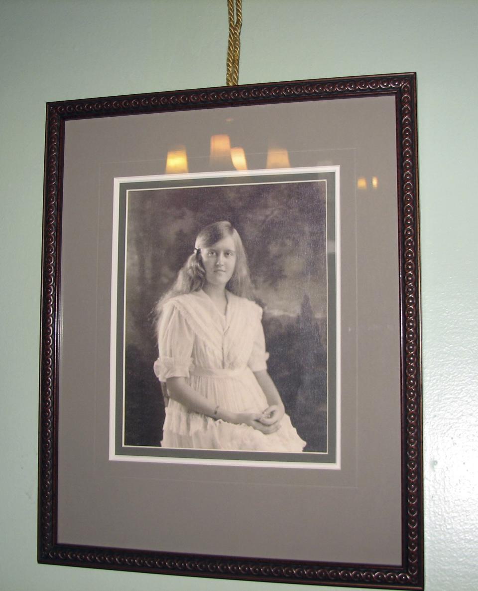 In this Dec. 24, 2011 photo, a portrait of heiress Huguette Clark hangs in one of the bedrooms of the Copper King Mansion in Butte, Mont. The 34-room mansion that W.A. Clark built in Butte more than a century ago is now a bed-and-breakfast and offers visitors a glimpse into the pampered lives of the robber barons who ruled American business at the turn of the previous century. (AP Photo/Nicholas K. Geranios)