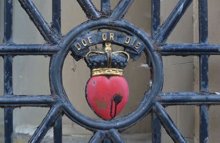 A design commemorating Scottish hero Robert the Bruce is seen on the gates of a meeting point for the Flodden Border Relay in Kelso, southern Scotland in this September 5, 2013 file photo. REUTERS/Toby Melville/Files