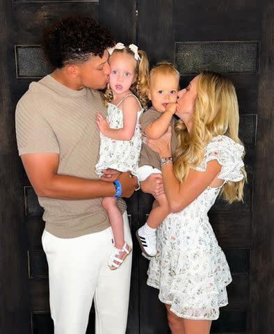 <p>Brittany Mahomes/instagram</p> Patrick and Brittany Mahomes kissing their kids