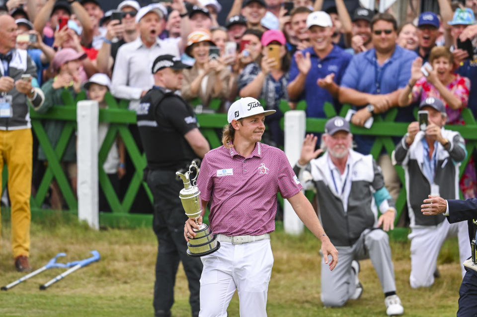 Cameron Smith (pictured) smiles as he walks with the Claret Jug trophy.