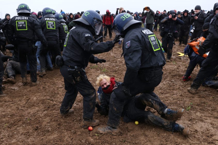 Riot police fight protesters in the German village of Luetzerath. 