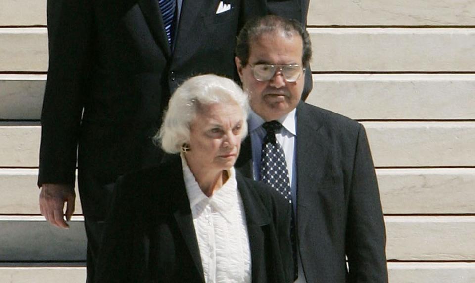 U.S. Supreme Court Justice Sandra Day O'Connor and Justice John Paul Stevens file out of the Supreme Court Building to attend funeral services for former Chief Justice William Rehnquist on Sept. 7, 2005, in Washington, D.C.