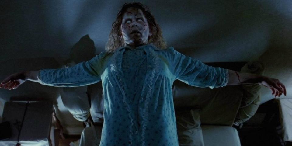 Linda Blair as Regan MacNeil possessed and floating with her arms spread wide in The Exorcist