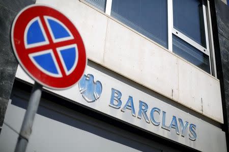 A "no parking" road sign is seen in front of a Barclays branch in downtown Rome May 8, 2014. REUTERS/Max Rossi