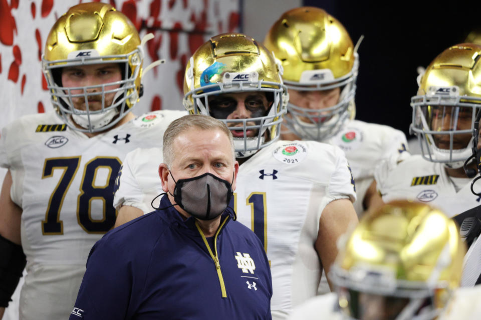 ARLINGTON, TEXAS - JANUARY 01: Head coach Brian Kelly of the Notre Dame Fighting Irish and team take the field for the 2021 College Football Playoff Semifinal Game at the Rose Bowl Game presented by Capital One against the Alabama Crimson Tide at AT&T Stadium on January 01, 2021 in Arlington, Texas. (Photo by Ronald Martinez/Getty Images)