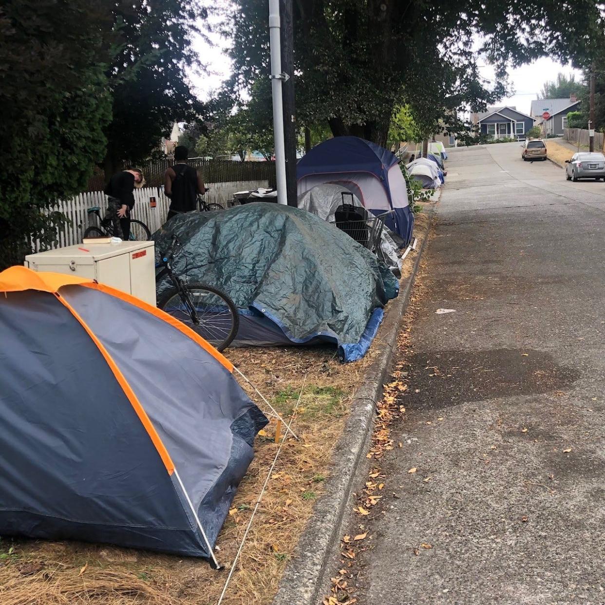 Tents line Broadway Avenue in Bremerton on Labor Day weekend. A tent encampment has recently gathered on the street, though the Bremerton City Council is considering a city ordinance that would once again make unauthorized camping on public property illegal.