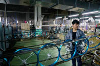 Employees work on the production line of Kent bicycles at Shanghai General Sports Co., Ltd, in Kunshan, Jiangsu Province, China, February 22, 2019. Picture taken February 22, 2019. REUTERS/Aly Song