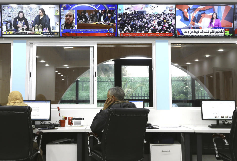 Journalists work at a private television broadcaster in Algiers, Tuesday, March 19, 2024. Algerian officials are chiding television stations over the content choices they've made during Ramadan. Their criticisms come amid broader struggles facing journalists and broadcasters, which have historically relied heavily on advertising from the state and Sonatrach, its largest oil and gas company. (AP Photo/Anis Belghoul)