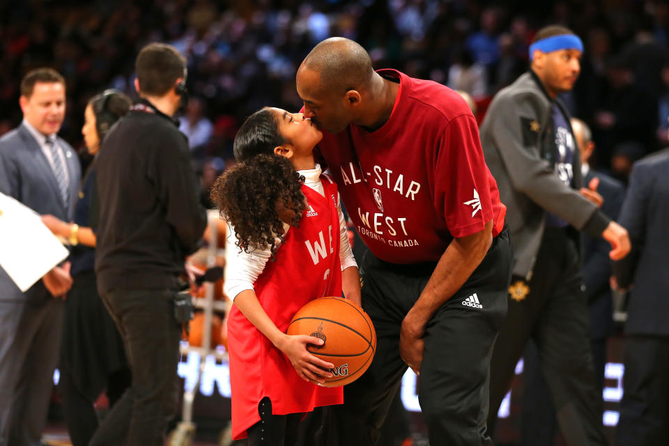 TORONTO, ON - FEBRUARY 14:  Kobe Bryant #24 of the Los Angeles Lakers and the Western Conference kisses daughter Gianna Bryant during the NBA All-Star Game 2016 at the Air Canada Centre on February 14, 2016 in Toronto, Ontario. NOTE TO USER: User expressly acknowledges and agrees that, by downloading and/or using this Photograph, user is consenting to the terms and conditions of the Getty Images License Agreement.  (Photo by Elsa/Getty Images)