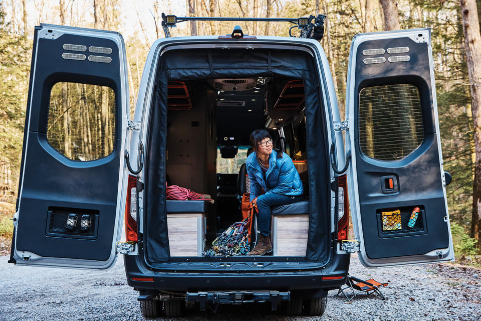 A person sitting in the back of the Airstream Interstate 24X adventure van