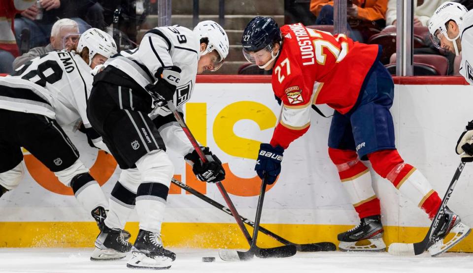 Florida Panthers center Eetu Luostarinen (27) fights for possession of the puck against Los Angeles Kings center Alex Turcotte (39) during the first period of an NHL game at the FLA Live Arena on Friday, Jan. 27, 2023, in Sunrise, Fla.