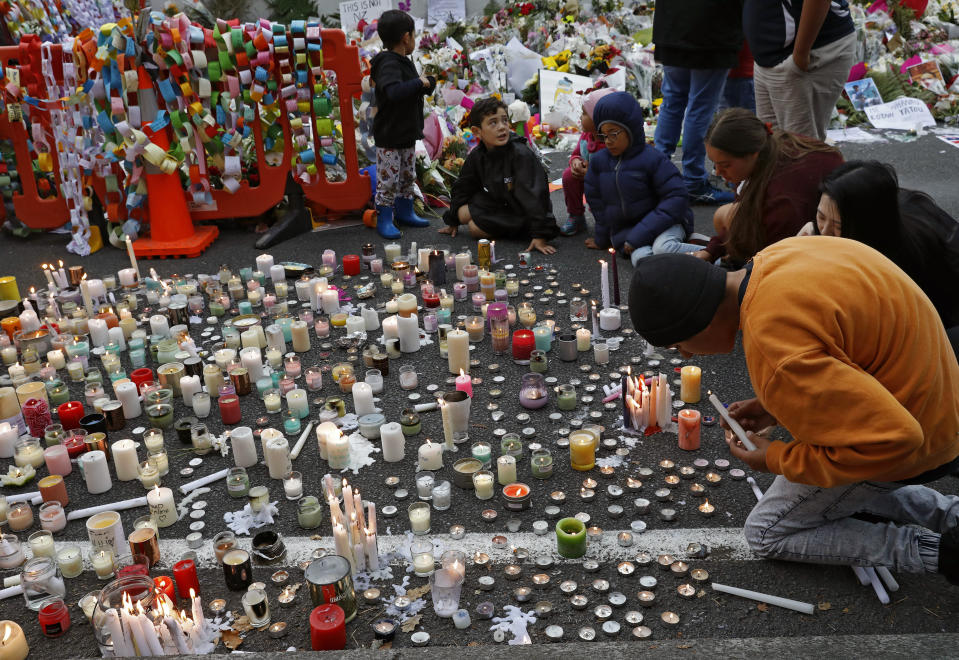 Students light candles as they gather for a vigil to commemorate victims of Friday's shooting, outside the Al Noor mosque in Christchurch, New Zealand, Monday, March 18, 2019. (Photo: Vincent Yu/AP)