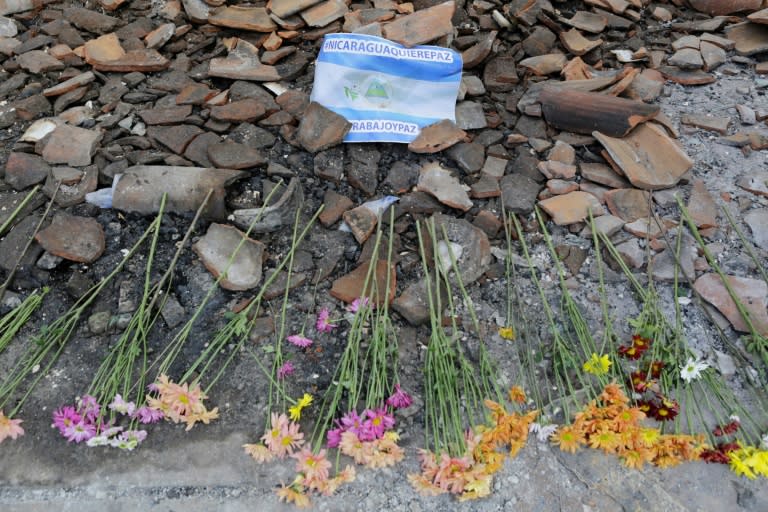 View of flowers placed over the rubble of the University Center of Nicaragua's National University in the Nicaraguan city of Leon, after it was set on fire during protests against President Daniel Ortega's government