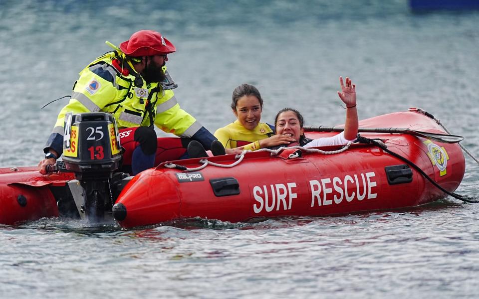 Katherinne Wollermann is 'rescued' from the water after she won gold