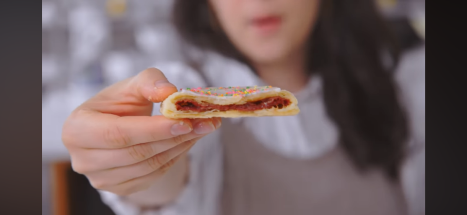 Pastry chef Claire Saffitz shows the strawberry filling of the gourmet Pop-Tart she created in the Bon Appétit Test Kitchen.