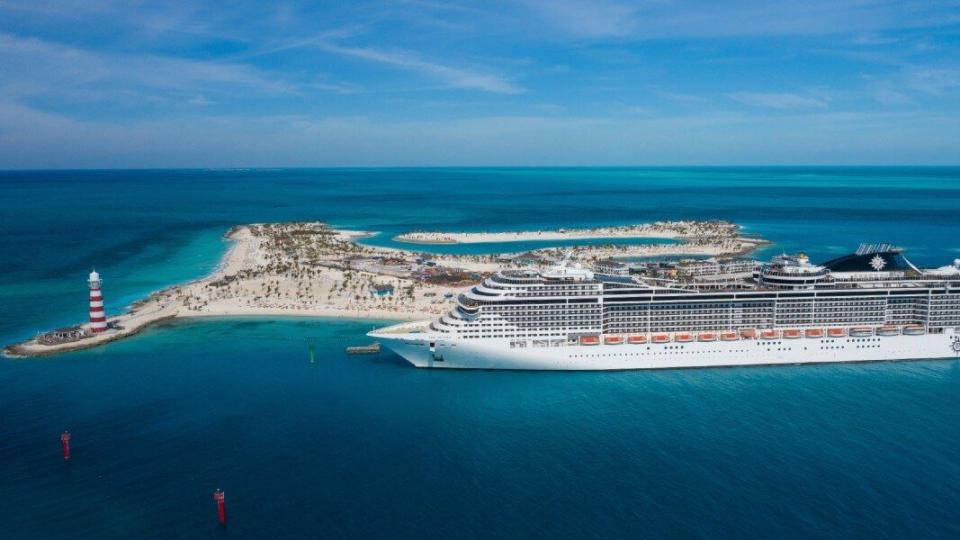 msc cruises ship in the ocean next to island