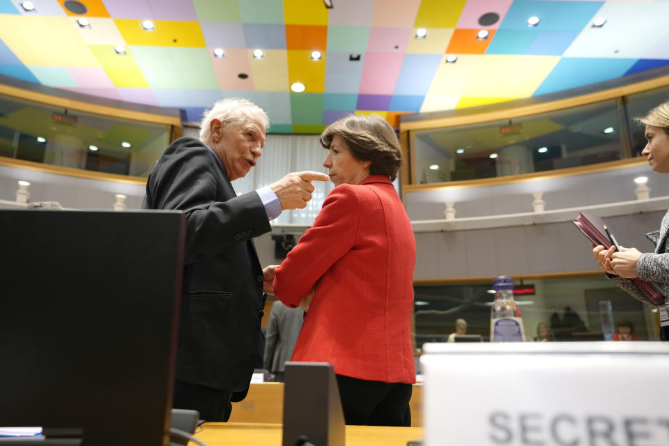 European Union foreign policy chief Josep Borrell, left, speaks with France's Foreign Minister Catherine Colonna during a meeting of EU foreign ministers at the European Council building in Brussels on Monday, March 20, 2023. European Union foreign ministers on Monday will discuss the situation in Ukraine and Tunisia. (AP Photo/Virginia Mayo)