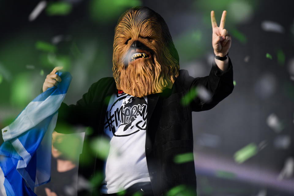 GLASGOW, SCOTLAND - JULY 14: Lewis Capaldi comes on stage wearing a Chewbacca mask to perform on the main stage during the TRNSMT Festival at Glasgow Green on July 14, 2019 in Glasgow, Scotland. A sold out final day will see music fans flock to see performances by Lewis Capaldi , Emeli Sande, The Kooks, The Wombats and Tom Grennan,closing with George Ezra. (Photo by Jeff J Mitchell/Getty Images)