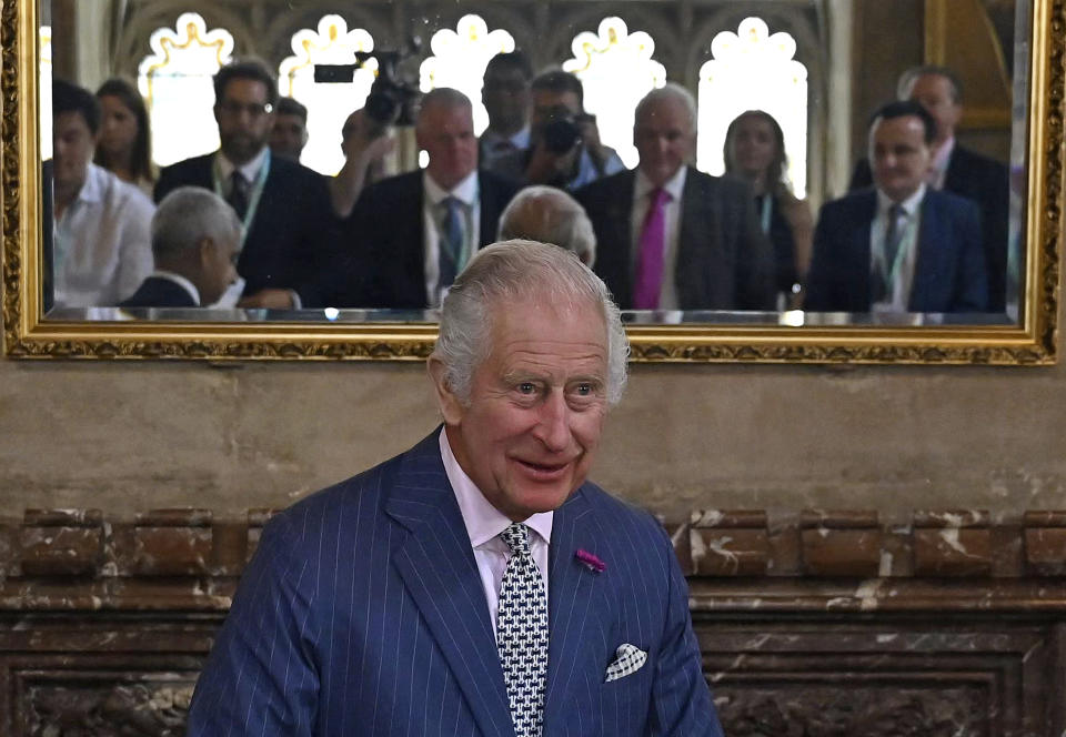 FILE - Britain's King Charles III takes his seat as he attends the Climate Innovation Forum at the Guildhall in London, Wednesday, June 28, 2023. A year after the death of Queen Elizabeth II triggered questions about the future of the British monarchy, King Charles III’s reign has been marked more by continuity than transformation, by changes in style rather than substance. (Justin Tallis/Pool Photo via AP, File)