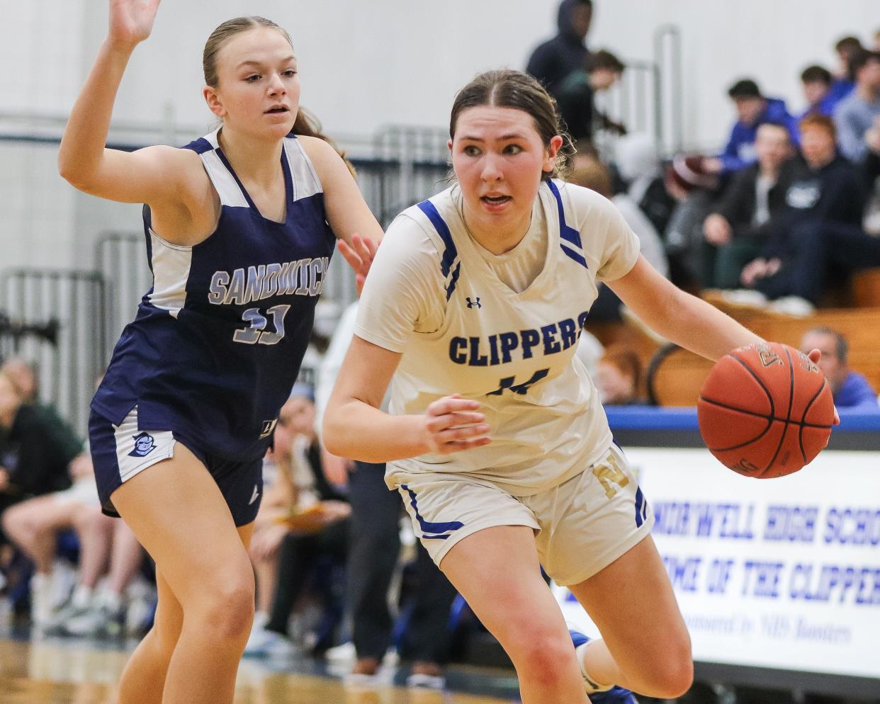 Norwell's Madison Oliver handles the ball against Sandwich's Tenley Rothera during a game at Norwell High School on Thursday, Jan. 25, 2024.