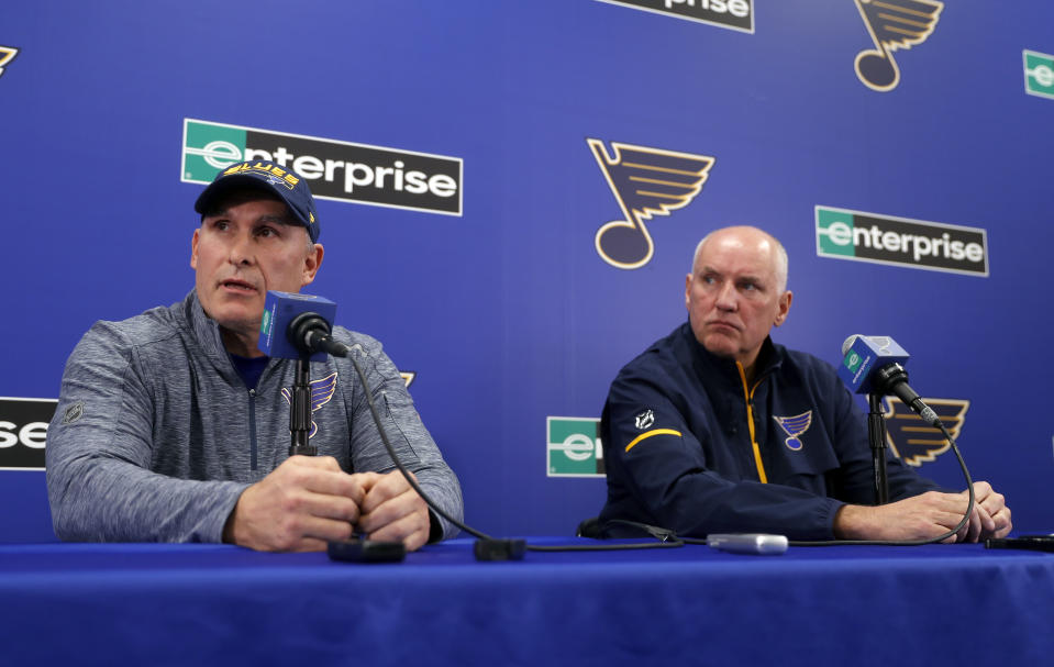 Craig Berube, left, speaks during a news conference along side St. Louis Blues general manager Doug Armstrong after Berube was named interim head coach of the NHL hockey team Tuesday, Nov. 20, 2018, in St. Louis. The Blues fired head coach Mike Yeo following a 2-0 loss to the Los Angeles Kings Monday night. (AP Photo/Jeff Roberson)