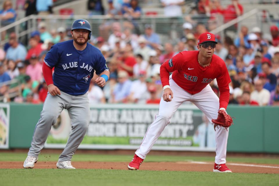 Blue Jays catcher Alejandro Kirk leads off first base as Red Sox infielder Triston Casas gets ready for a pitch during the game on March 3 at JetBlue Park.