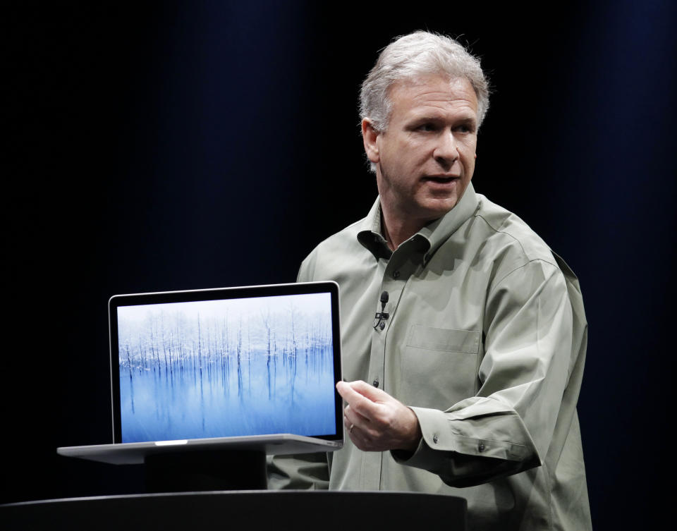 Apple's Phil Schiller speaks about the new MacBook Pro at the Apple Developers Conference in San Francisco, Monday, June 11, 2012. The MacBook Pro, will get a new Intel chip and prices for the 13-inch model will be $1,199 to $1,499, while a 15-inch model will be $1,799 or $2,199, depending on the amount of storage. The new MacBook Air and MacBook Pro models will start shipping Monday. (AP Photo/Paul Sakuma)