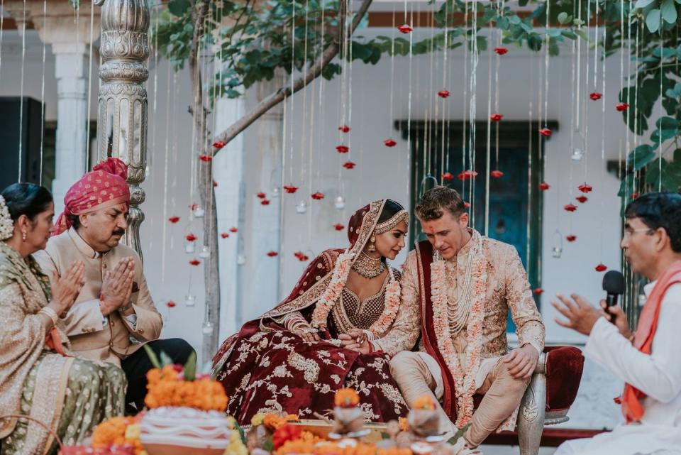 <p>The decor of a traditional Indian wedding is dramatic, bold, and festive in the most otherworldly of ways. Guests can expect the most jaw-dropping display of color, but it's the fine details that stand out—even at a ceremony packed with plush textures, embroidered fabrics, and vibrant hues. </p><p>Take the dangling blooms and candles at Diipa and Oleg's wedding (pictured here), which add texture and visual interest to the look of their mandap, and would just as beautifully complement any wedding altar. Choose a bloom or ornament that works for your color palette, floral design, and overall look. Then, take notes from this ceremony, where fluttering blooms and candles worked to create "walls" around the couple and their family, making the space feel simultaneously intimate and open.<br></p><p><em>Pictured: <a href="https://www.harpersbazaar.com/wedding/photos/a25397587/diipa-khosla-oleg-buller-wedding/" rel="nofollow noopener" target="_blank" data-ylk="slk:Diipa and Oleg's 4-day Wedding in India;elm:context_link;itc:0;sec:content-canvas" class="link ">Diipa and Oleg's 4-day Wedding in India</a>; Planning by <a href="https://www.ankit.in/" rel="nofollow noopener" target="_blank" data-ylk="slk:Ankit;elm:context_link;itc:0;sec:content-canvas" class="link ">Ankit</a>; Design and florals by <a href="http://www.altair-decor.com/" rel="nofollow noopener" target="_blank" data-ylk="slk:Alt Air;elm:context_link;itc:0;sec:content-canvas" class="link ">Alt Air</a>. </em></p>