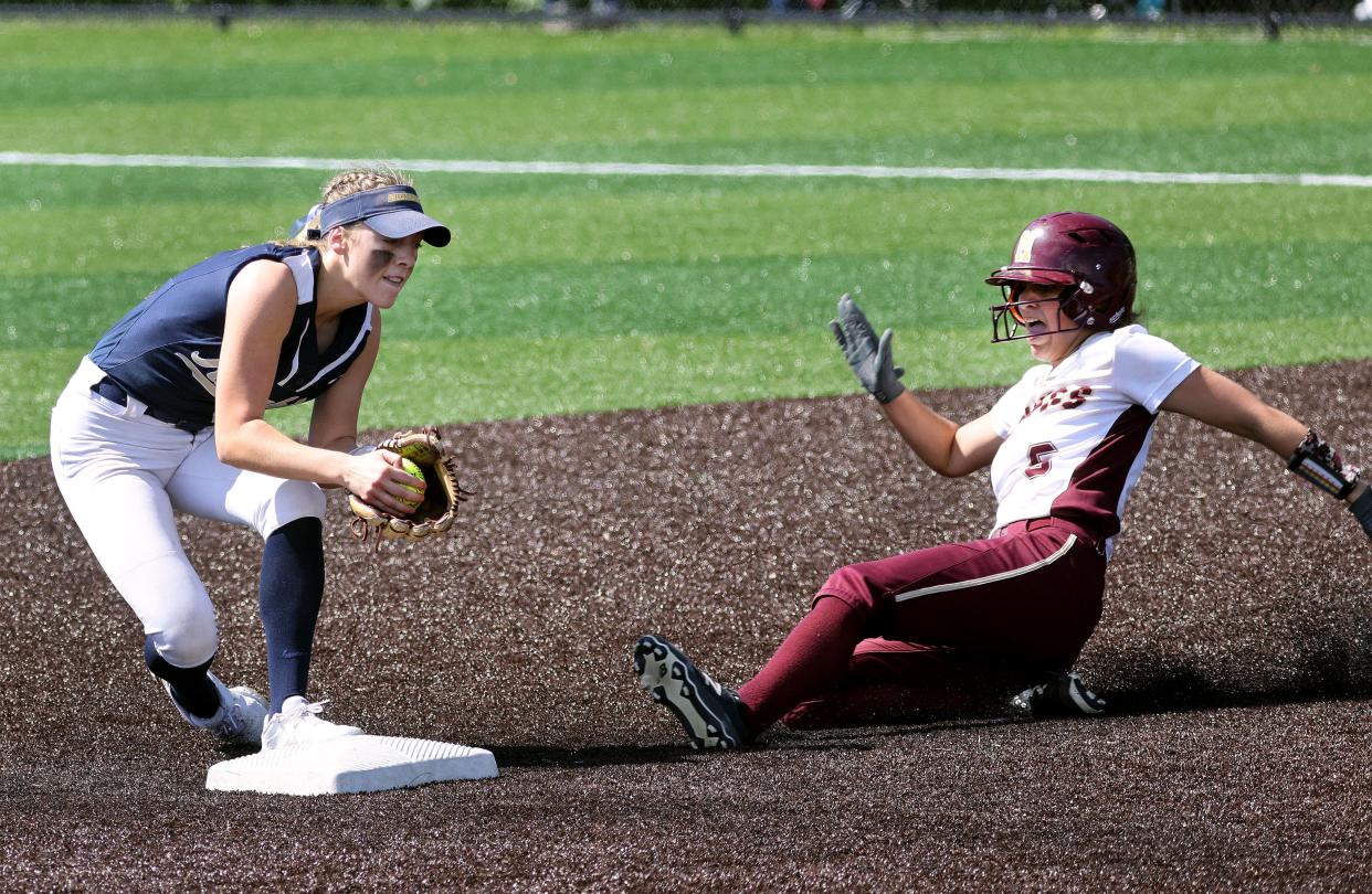 Sutherland second baseman Addison Bernas can't tag out Mendon's Madeline Fallows.
