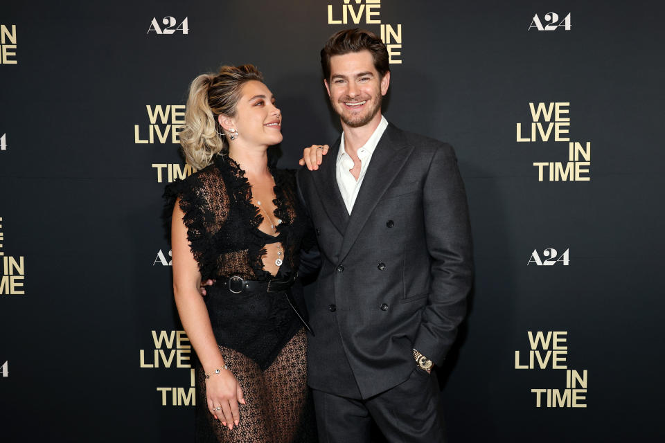 Florence Pugh in a lace dress and Andrew Garfield in a suit at an event for "We live in time"