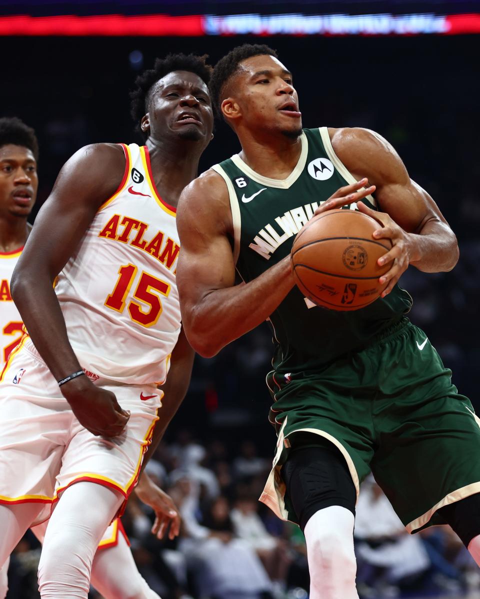 The Bucks' Giannis Antetokounmpo goes to the basket against Atlanta's Clint Capela in a preseason game Thursday in Abu Dhabi, United Arab Emirates.